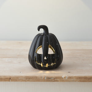 Carved Black Pumpkin Lanterns